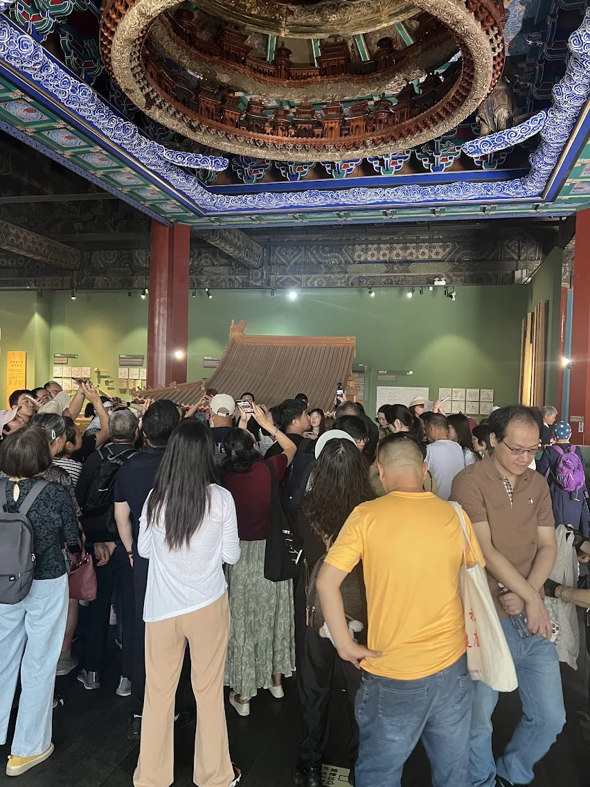 Tourists admiring the Longfu Temple Wanshan Zhengjue Hall Caisson Ceiling